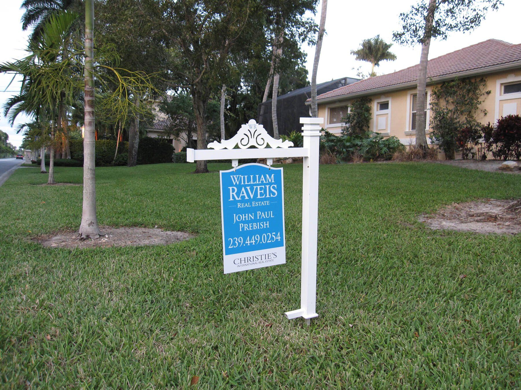A blue and white sign that says ravens on it