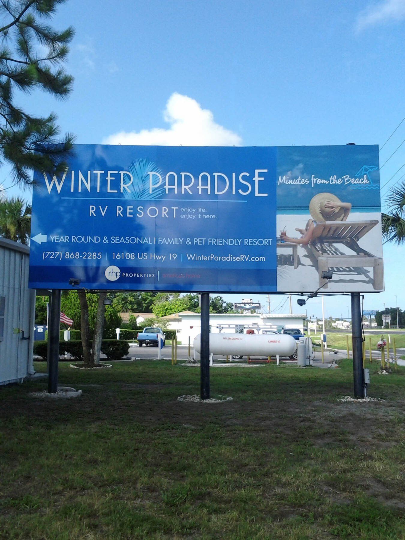A billboard for the winter paradise rv resort