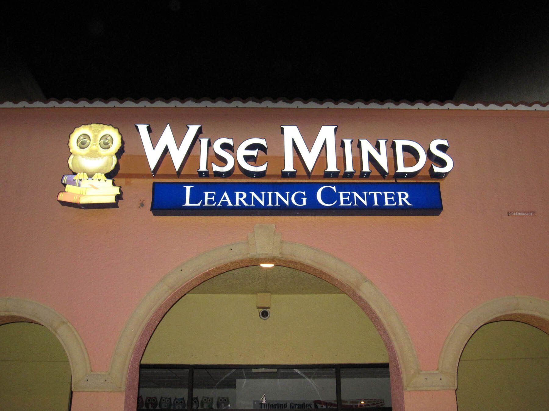 A building with a sign that says wise minds learning center