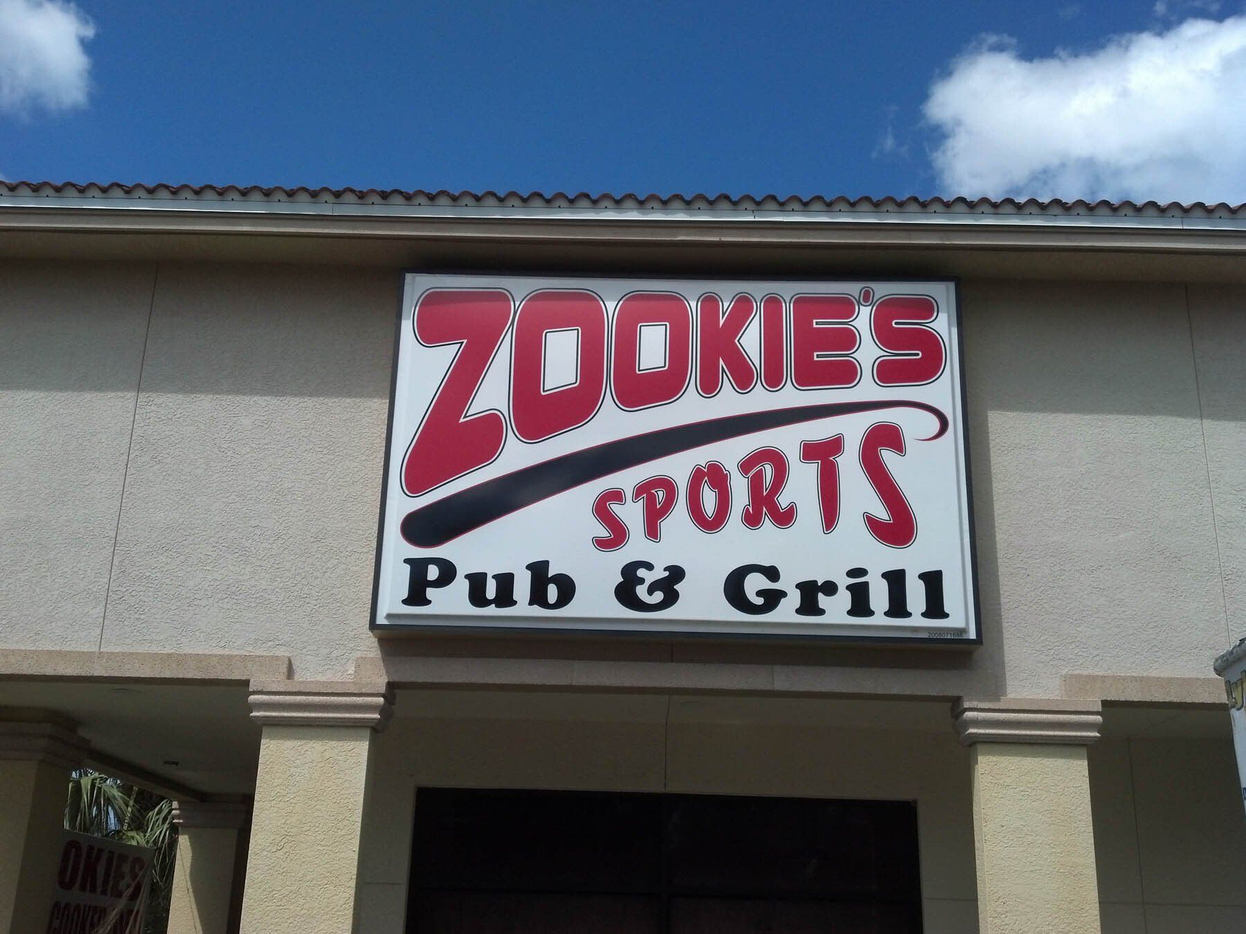 A zookies sports pub and grill sign on a building