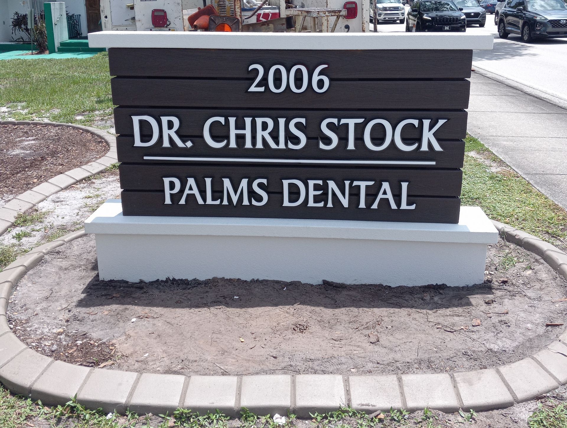 A sign for dr. chris stock palms dental in 2006