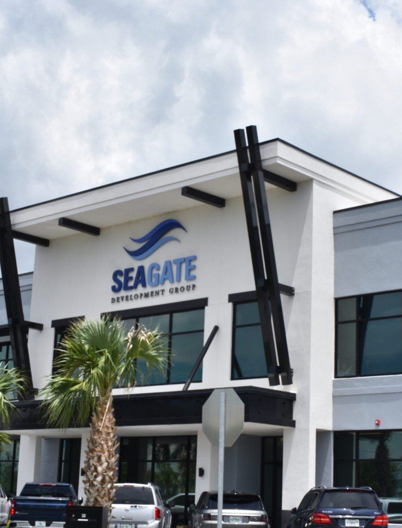 A seagate building with cars parked in front of it