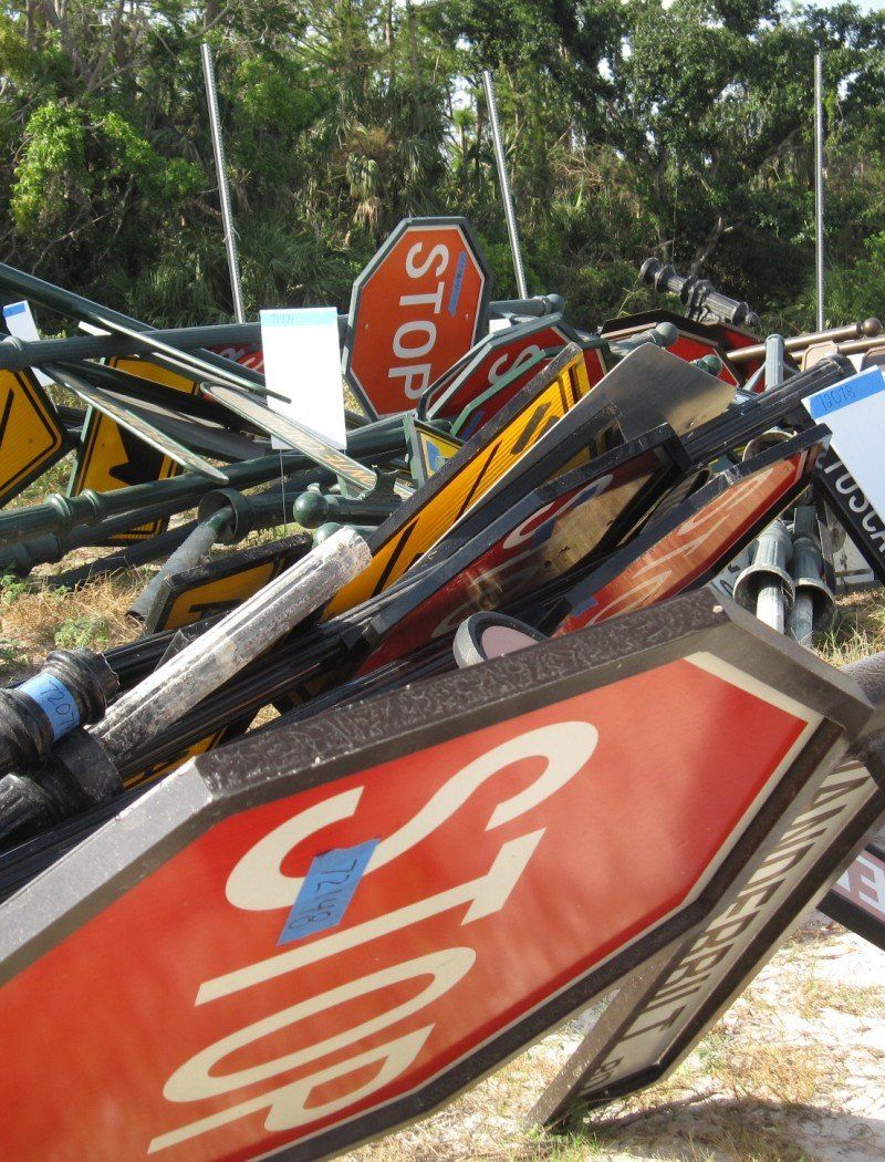 A bunch of stop signs are stacked on top of each other