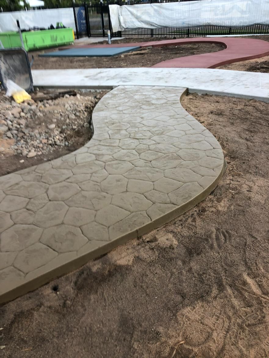 White House with White and Black Textured Driveway — Fallon Constructions NQ in Fredericksfield, QLD