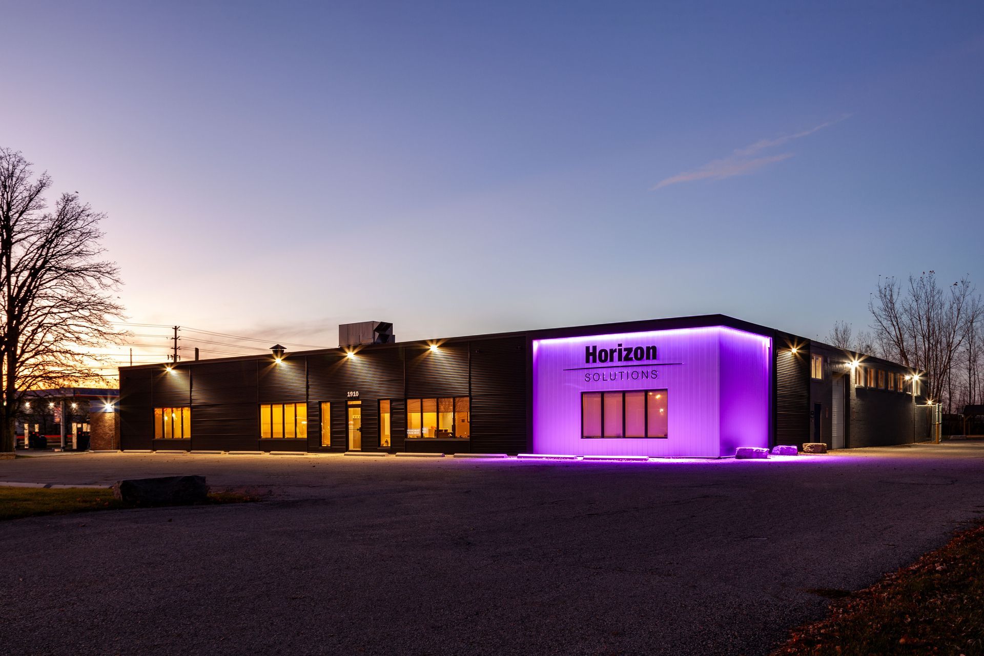 Horizon Solution Building illuminated at night