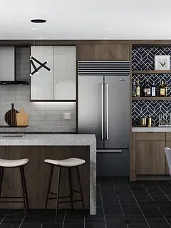 A kitchen with stainless steel appliances , wooden cabinets , and a stainless steel refrigerator.