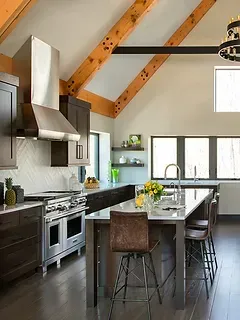 There is a large island in the middle of the kitchen.