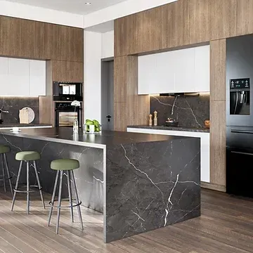 A kitchen with a large island and stools