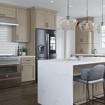 A kitchen with stainless steel appliances and a large island.