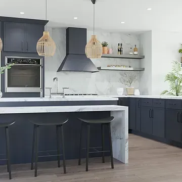 A kitchen with a large island , stools , and a stove.