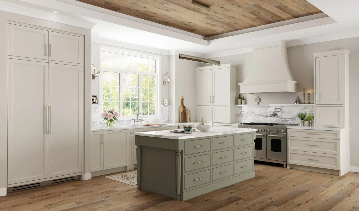 A kitchen with white cabinets and a large island in the middle.