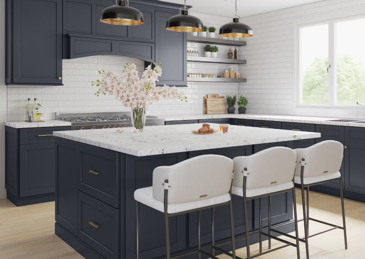 A kitchen with blue cabinets , white counter tops , and a large island.