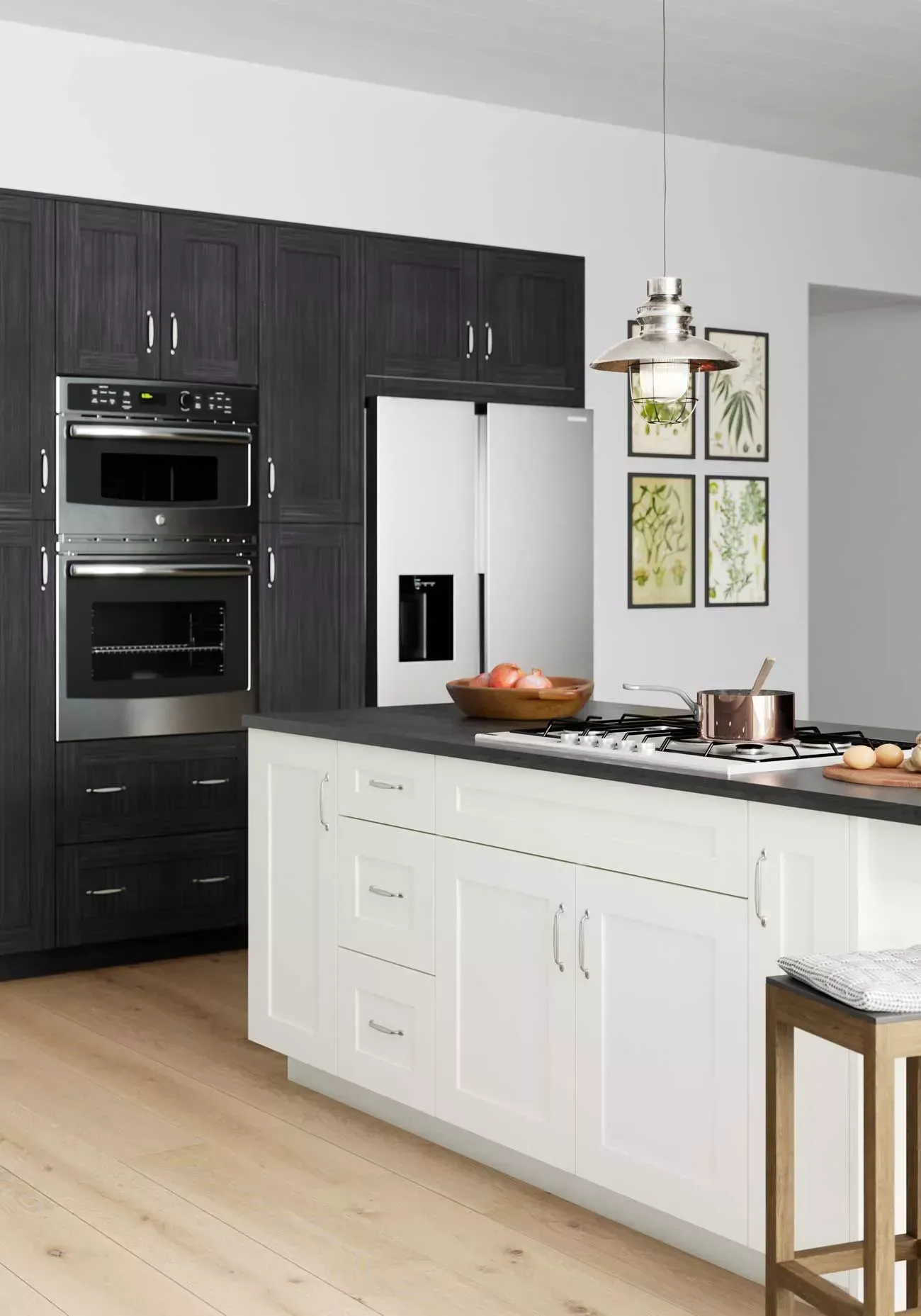 A kitchen with black cabinets and white cabinets and a stainless steel refrigerator