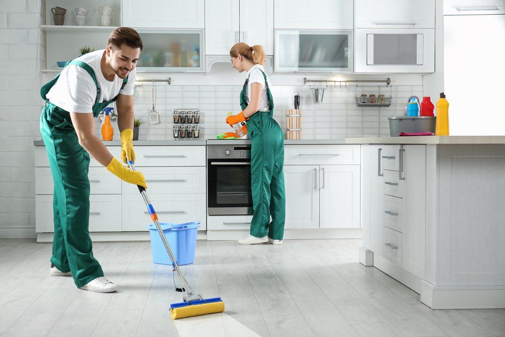 Professional Team Cleaning a Residential Kitchen