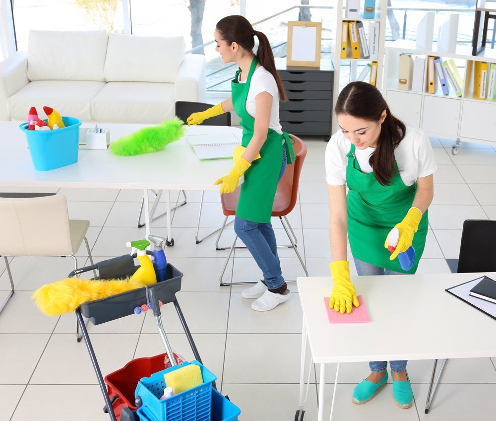 Women Cleaning Tables