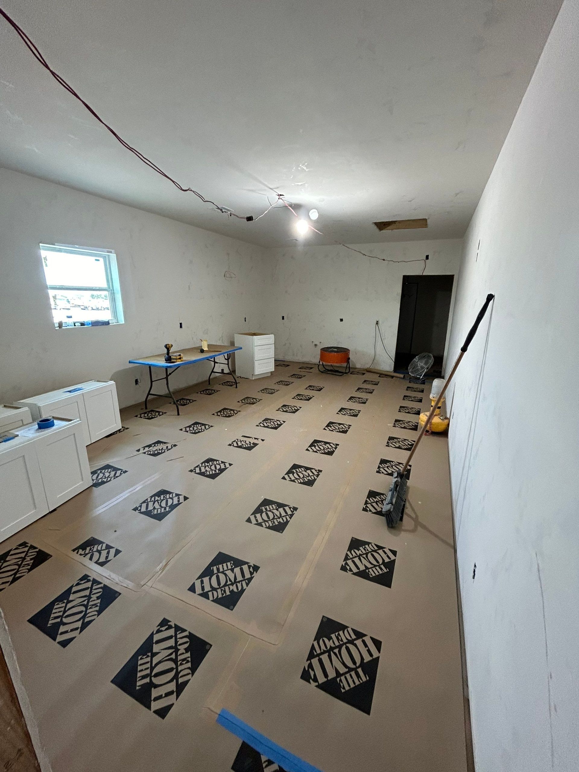 A room with a lot of cardboard on the floor