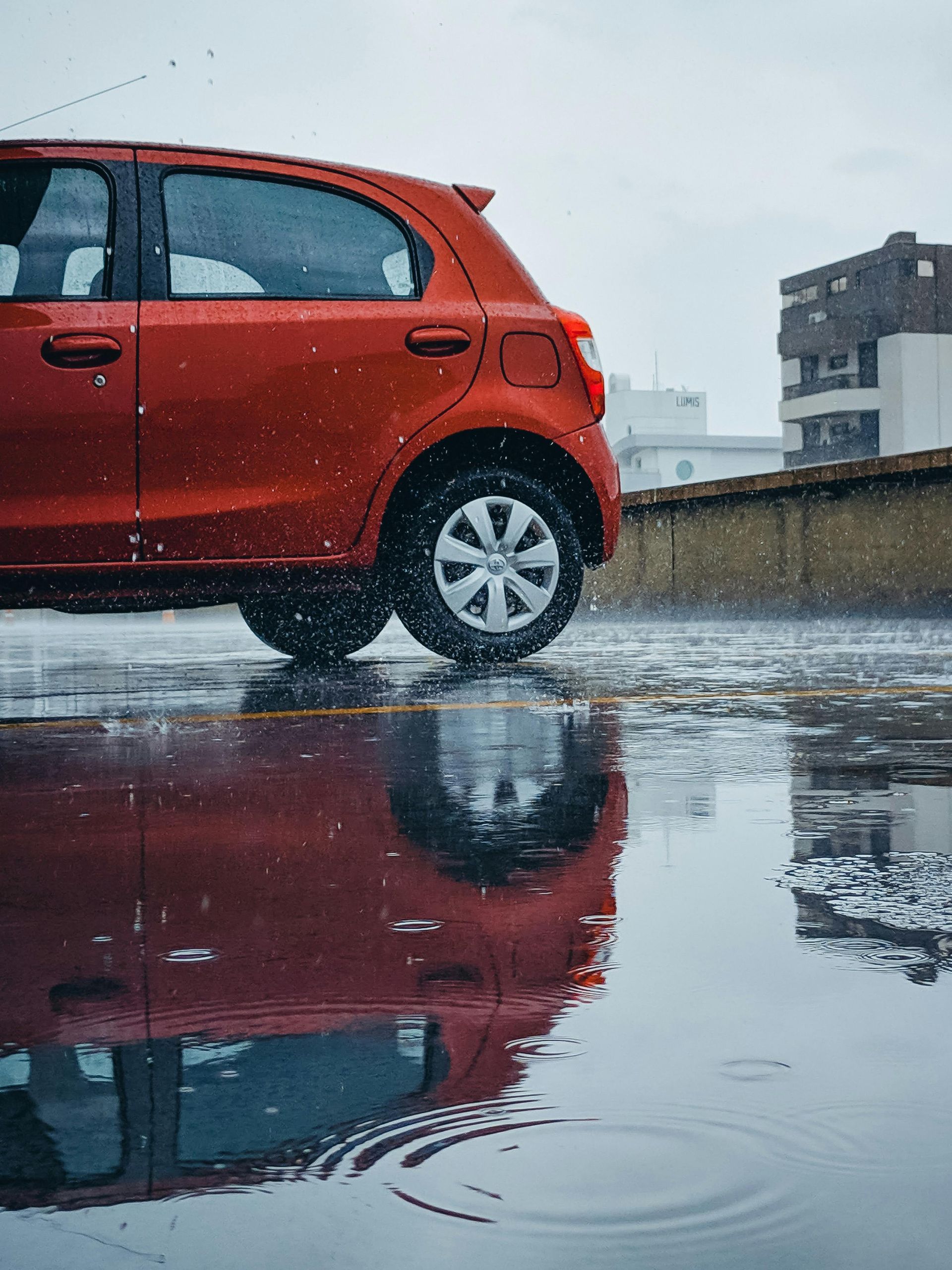 red suv with large hail dent fixed quickly in parkinglot of O'Fallon MO work place | Exact Dent