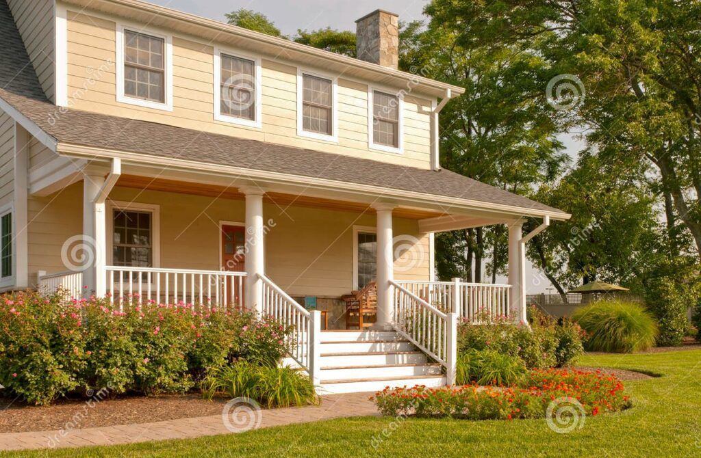 a house with a large porch and stairs