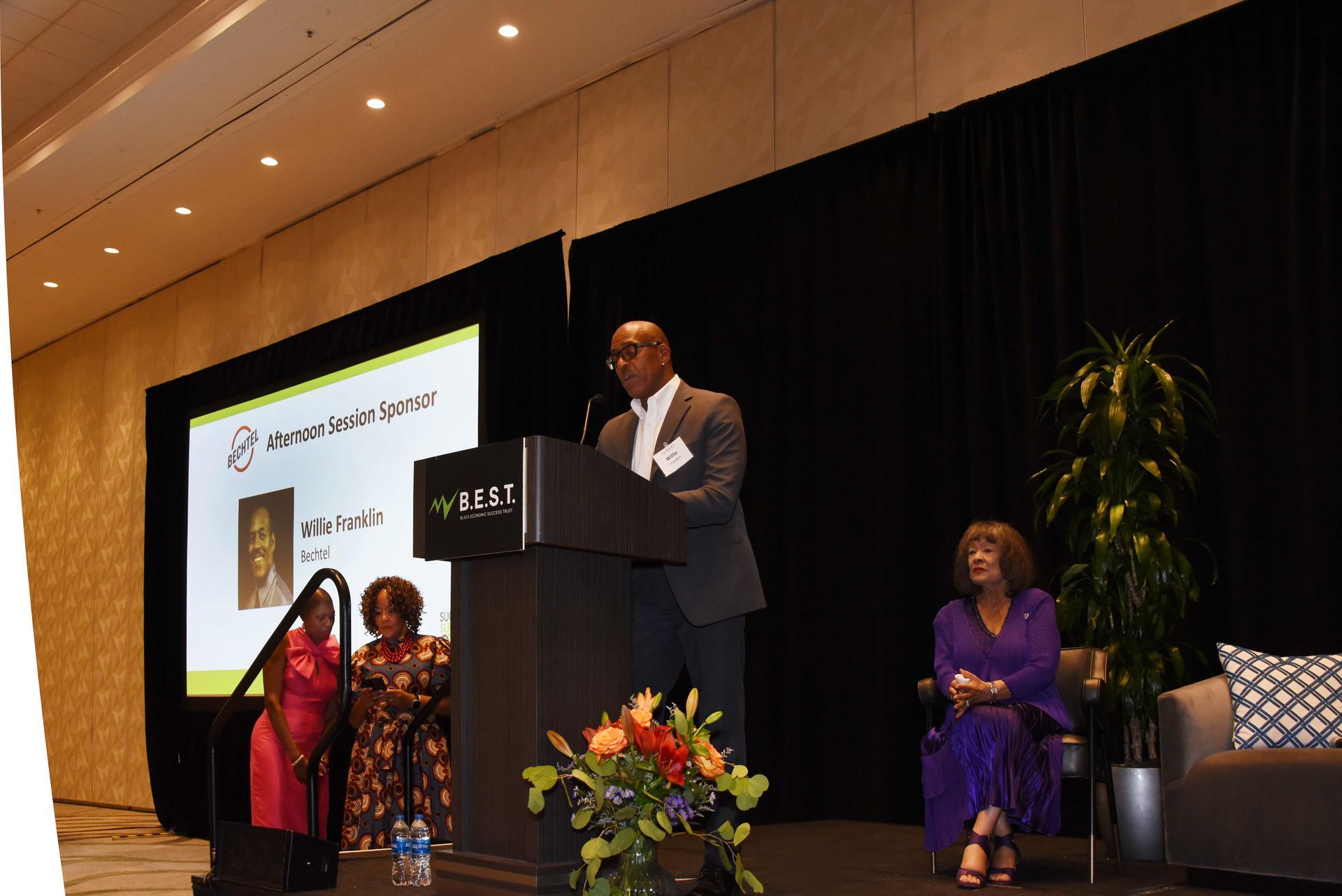 A man stands at a podium giving a speech