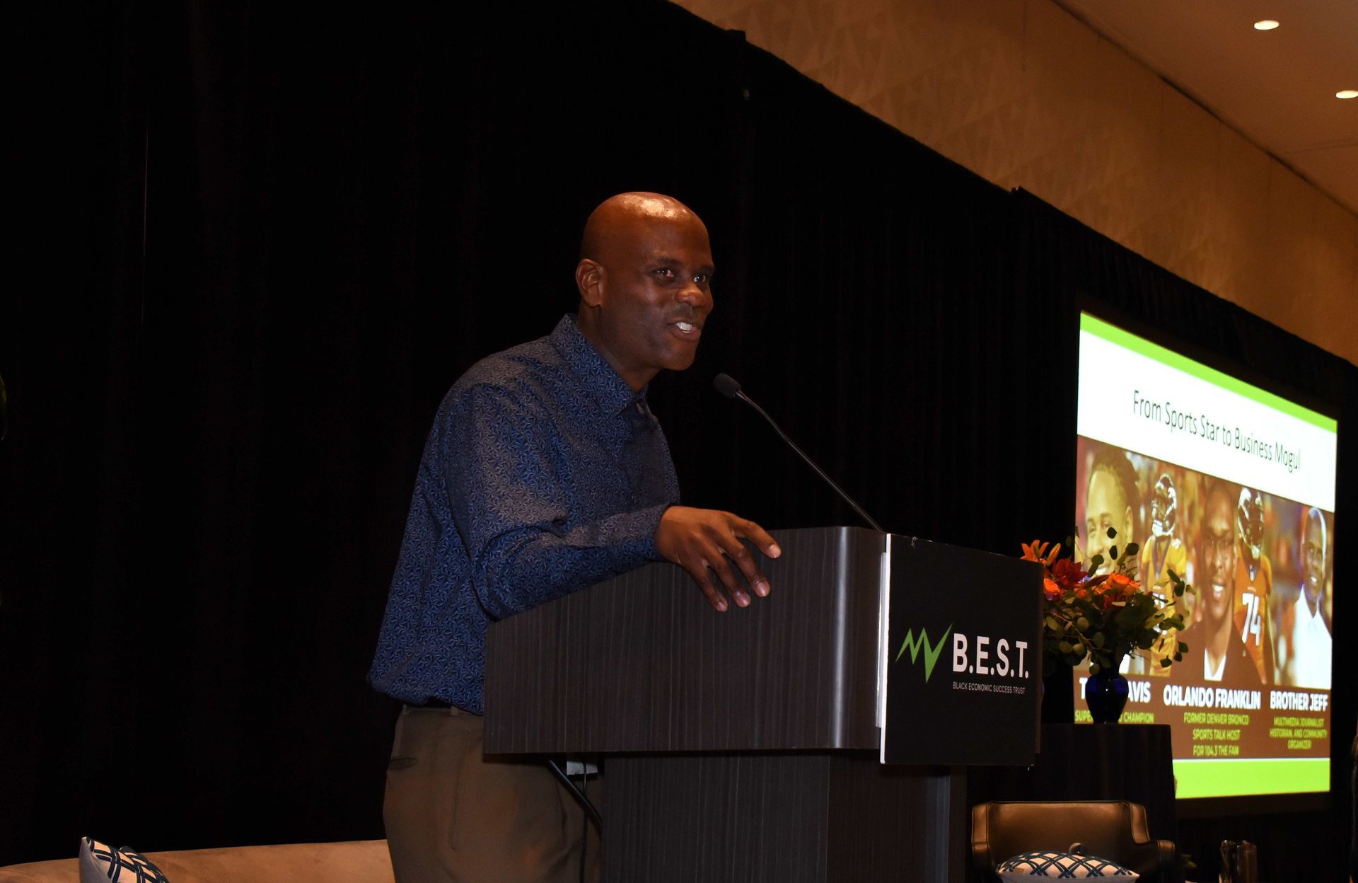 A man is standing at a podium giving a speech.