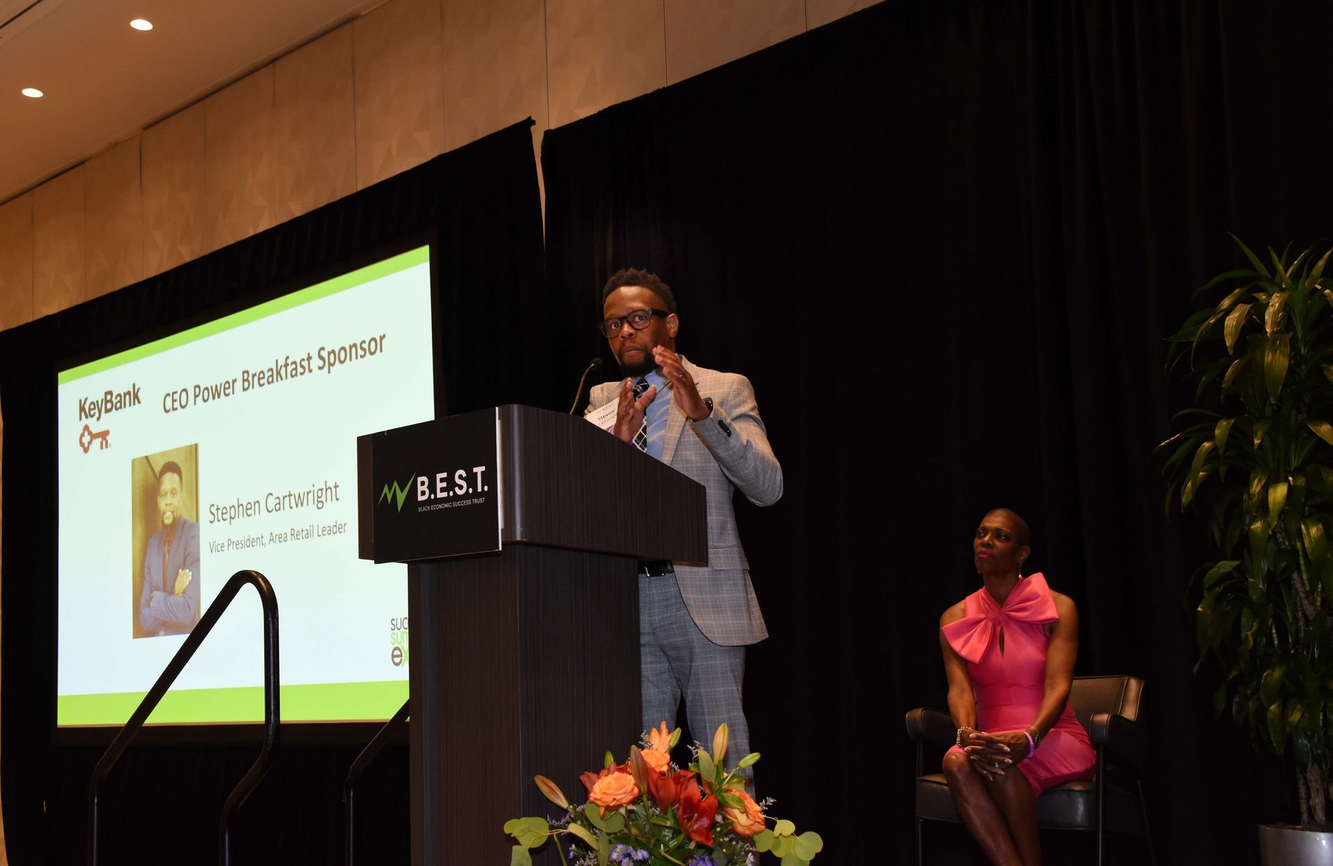 A man is standing at a podium giving a speech.