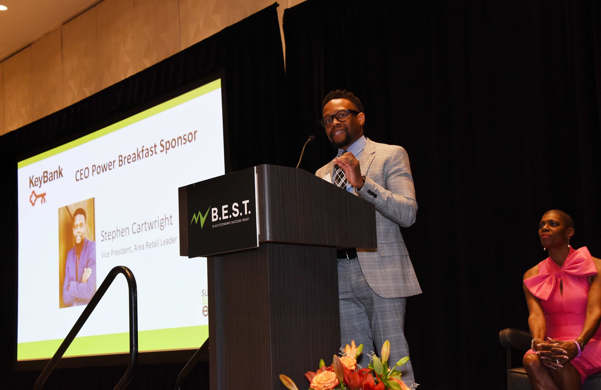 A man is standing at a podium giving a speech.