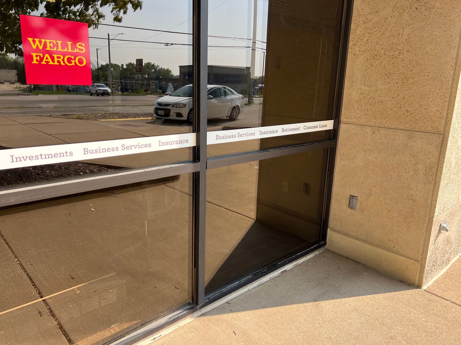 A wells fargo sign is on the side of a building