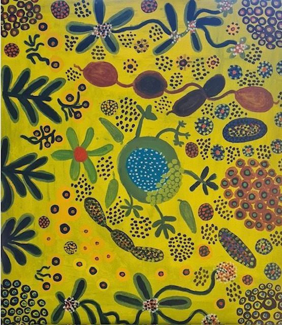 A Stack of Canvas is Sitting on Top of a Table — Next Level Picture Framing In Ballina, NSW