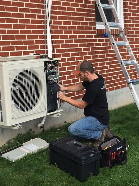 Man Repairs Air Condition— Richland, PA — New Aire Tech LLC