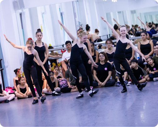 Image 1: A group of young girls are dancing in a dance studio