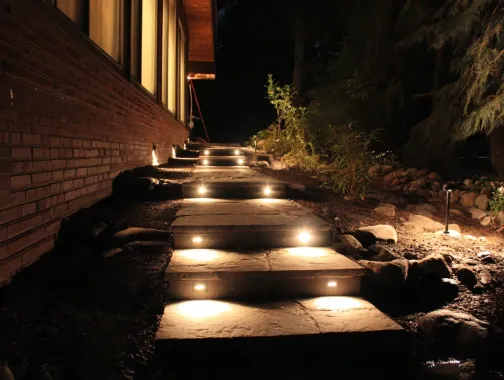 A low voltage transformer, the heart of a landscape lighting Burnaby system. A professional from our outdoor lighting Burnaby team installs and configures the 12V transformer for optimal performance. Proper setup is crucial for garden lighting longevity. Keywords: Burnaby landscape lighting installation, certified electrician, exterior lighting solutions, wiring, safety, Metro Vancouver, BC.