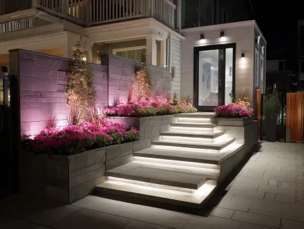 A certified technician from our landscape lighting services Burnaby BC company at work. We provide professional, safe outdoor lighting services, ensuring all low voltage systems are installed to the highest standards in British Columbia. Keywords: Burnaby garden lighting services, expert installers, exterior lighting solutions, transformer wiring, certified, reliable.