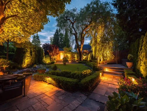 A certified electrician performs a professional landscape lighting installation in Burnaby. This image shows the meticulous wiring of a low voltage outdoor lighting system. For safe and reliable garden lighting in Burnaby, BC, expert installation is key. We provide complete exterior lighting solutions in Metro Vancouver. Keywords: Burnaby landscape lighting, low voltage lighting solutions Burnaby, transformer, 12V, safety standards, BCIT area.