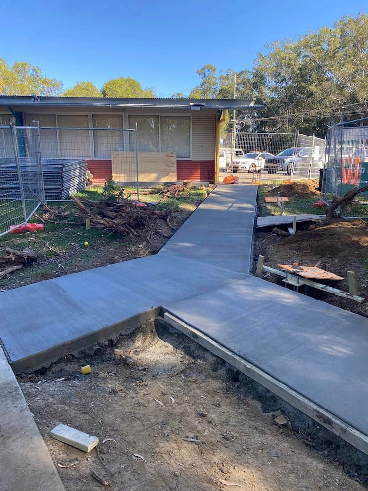 Newly Poured Concrete Walkways at a Building Construction Site — JDC Concreting in Grafton, NSW