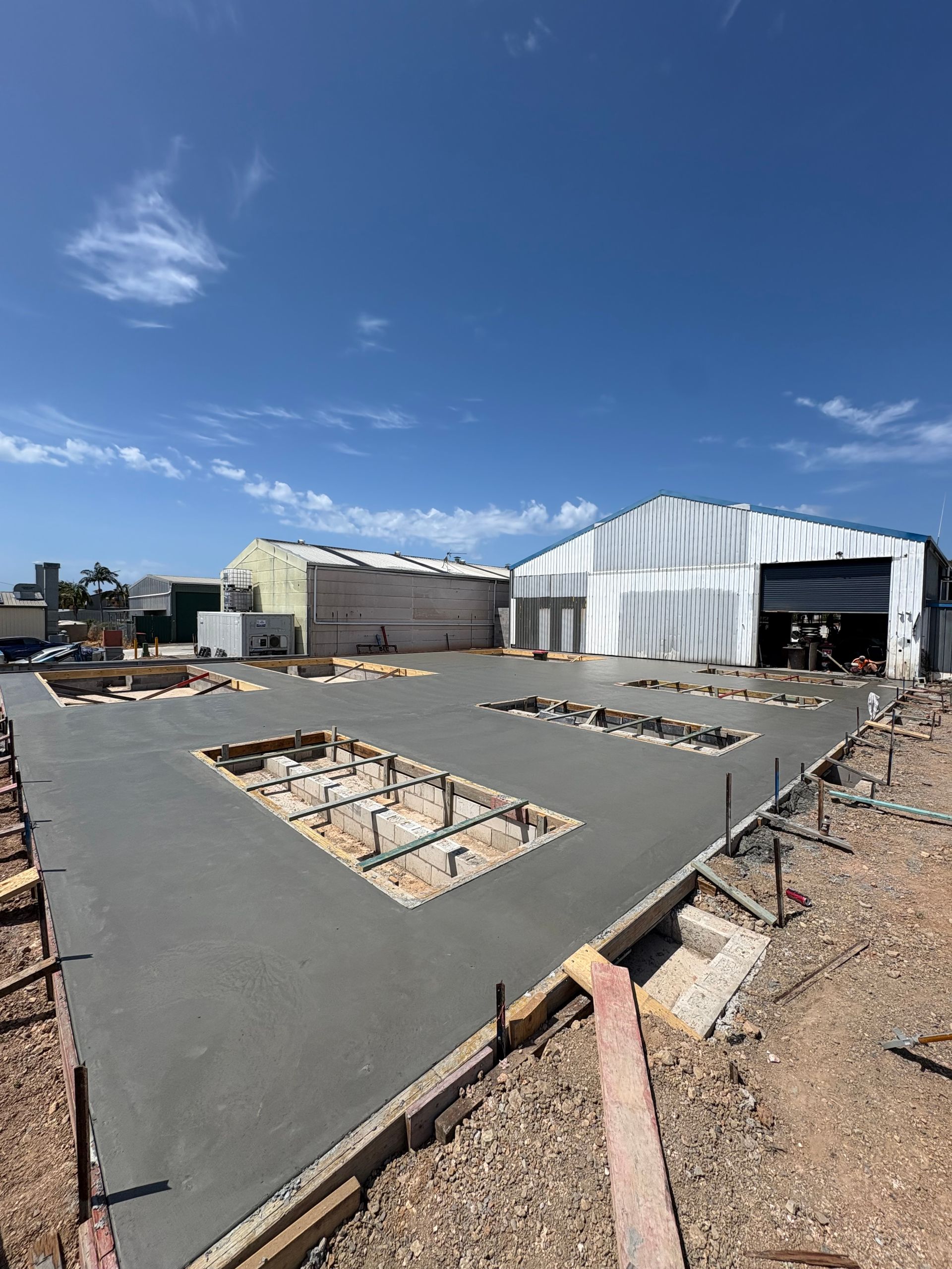 Newly poured concrete slab with rectangular openings — JDC Concreting in Grafton, NSW