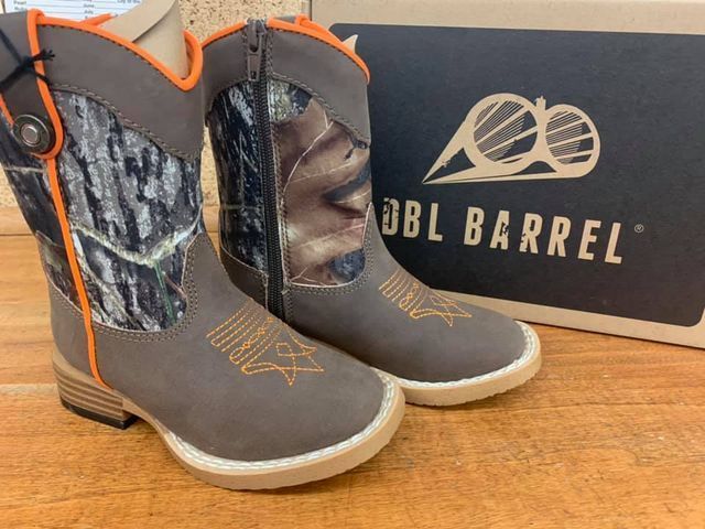 Brown and camo western boots with orange accents, beside a 