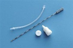 Medical instruments: needle, tubing, and containers on blue background.