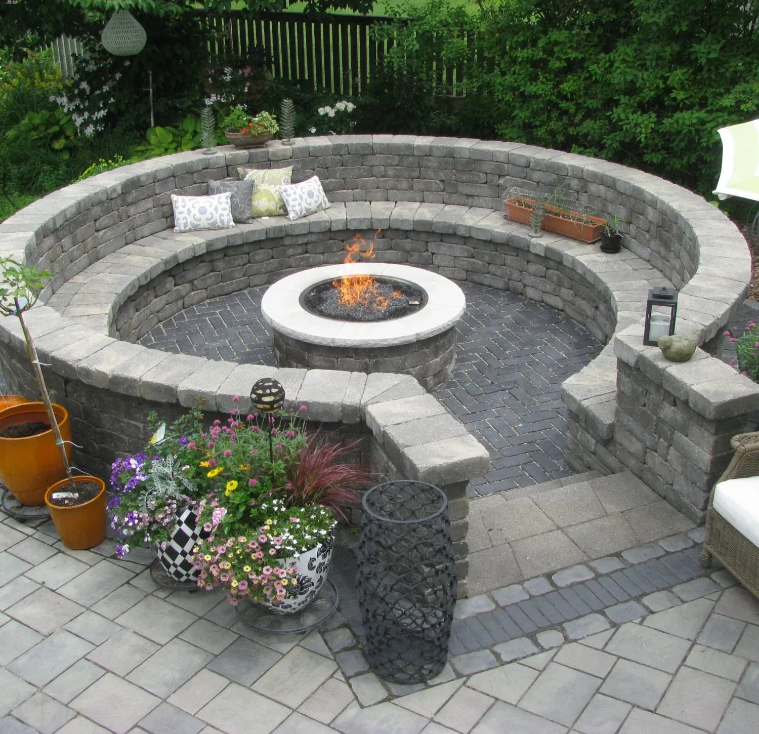 A fire pit in the middle of a brick patio — Waterloo, IA — Matthias Landscaping Co