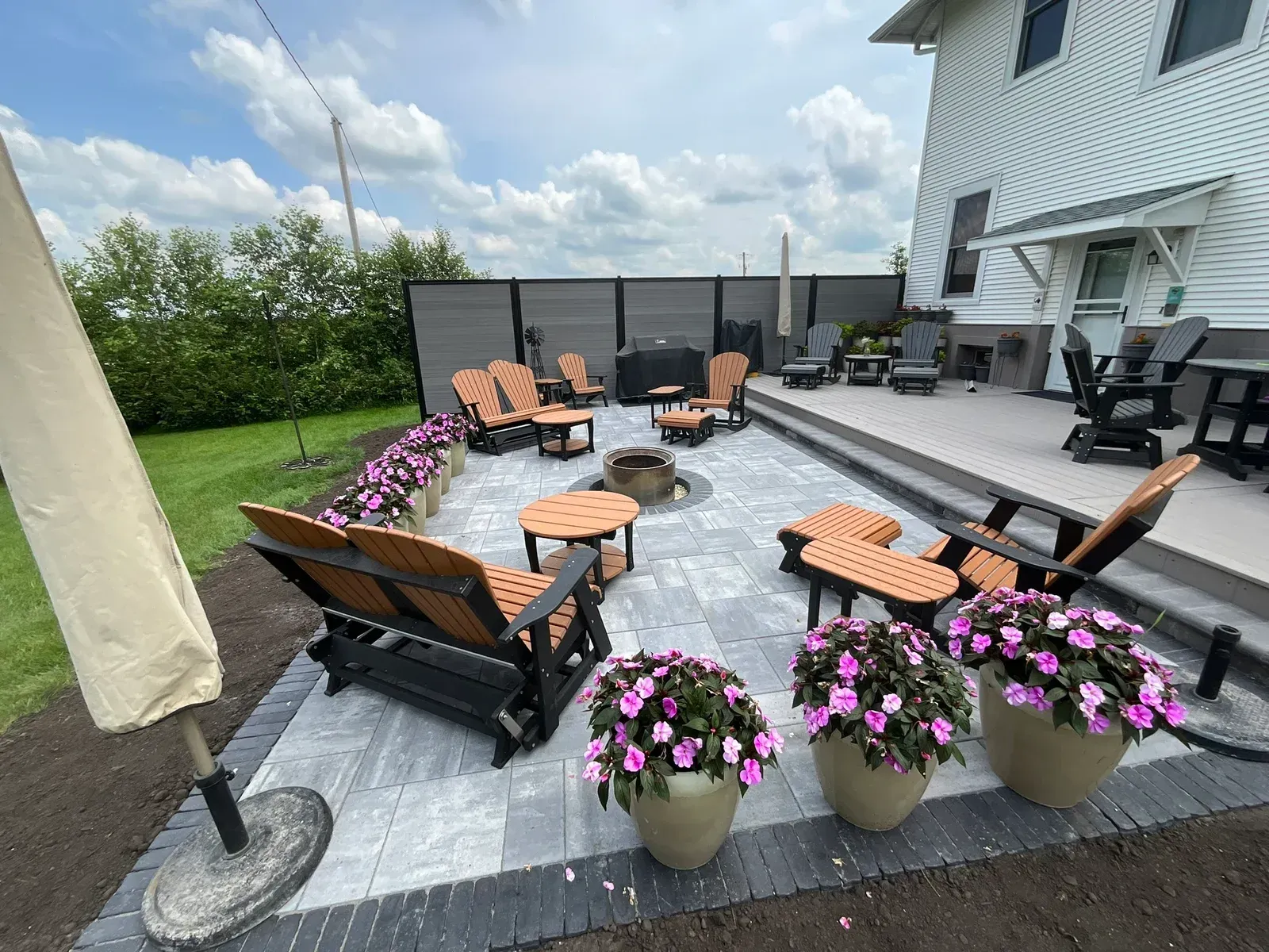 There is a fire pit in the middle of the patio — Waterloo, IA — Matthias Landscaping Co