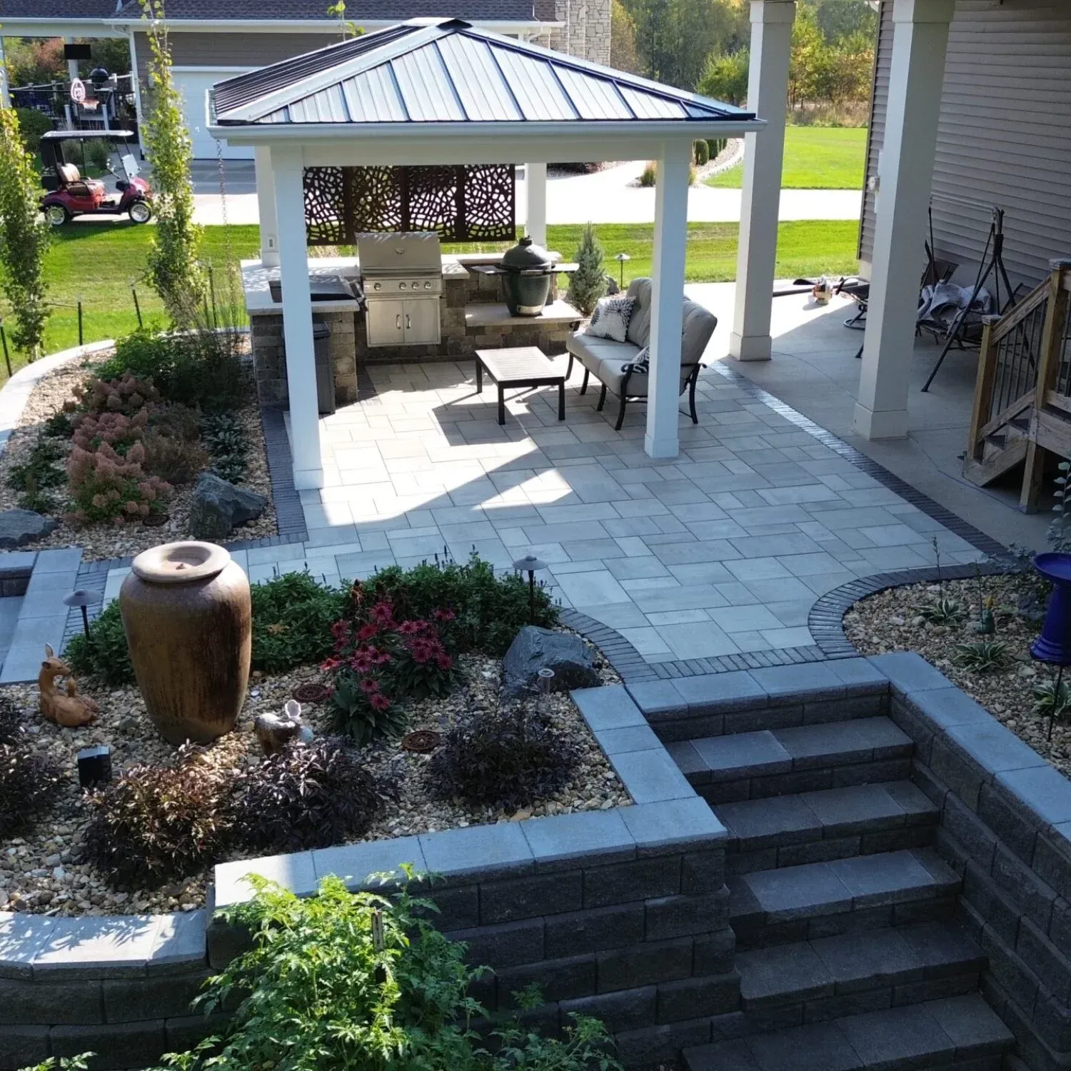A patio with a gazebo and stairs leading up to it — Waterloo, IA — Matthias Landscaping Co
