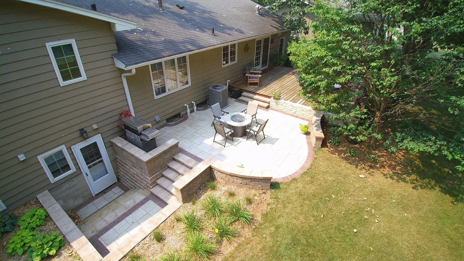 An aerial view of a house with a patio and stairs — Waterloo, IA — Matthias Landscaping Co