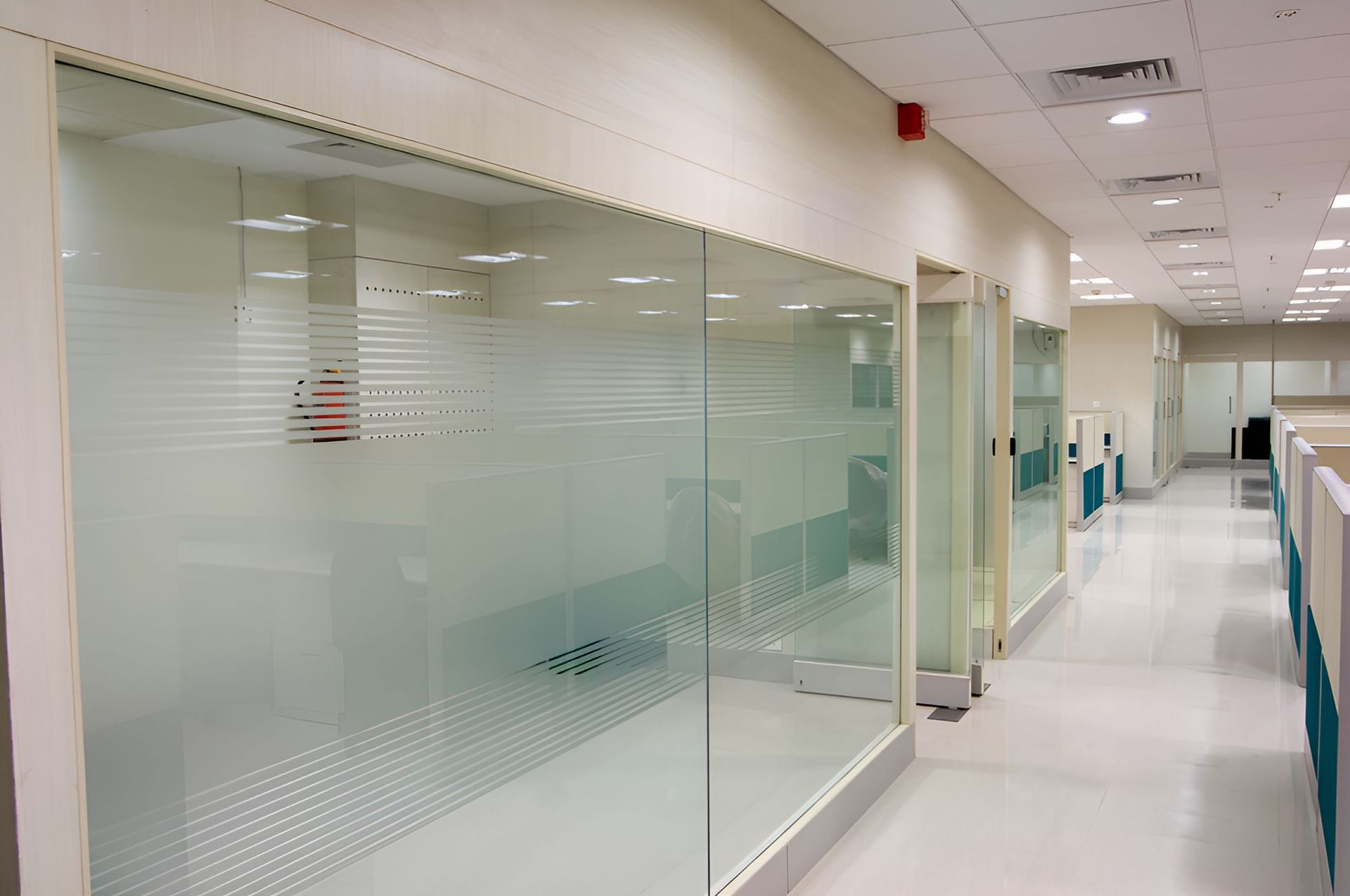 A Hallway With a Lot of Glass Walls and Doors — Twin Cities Glass In Albury, NSW