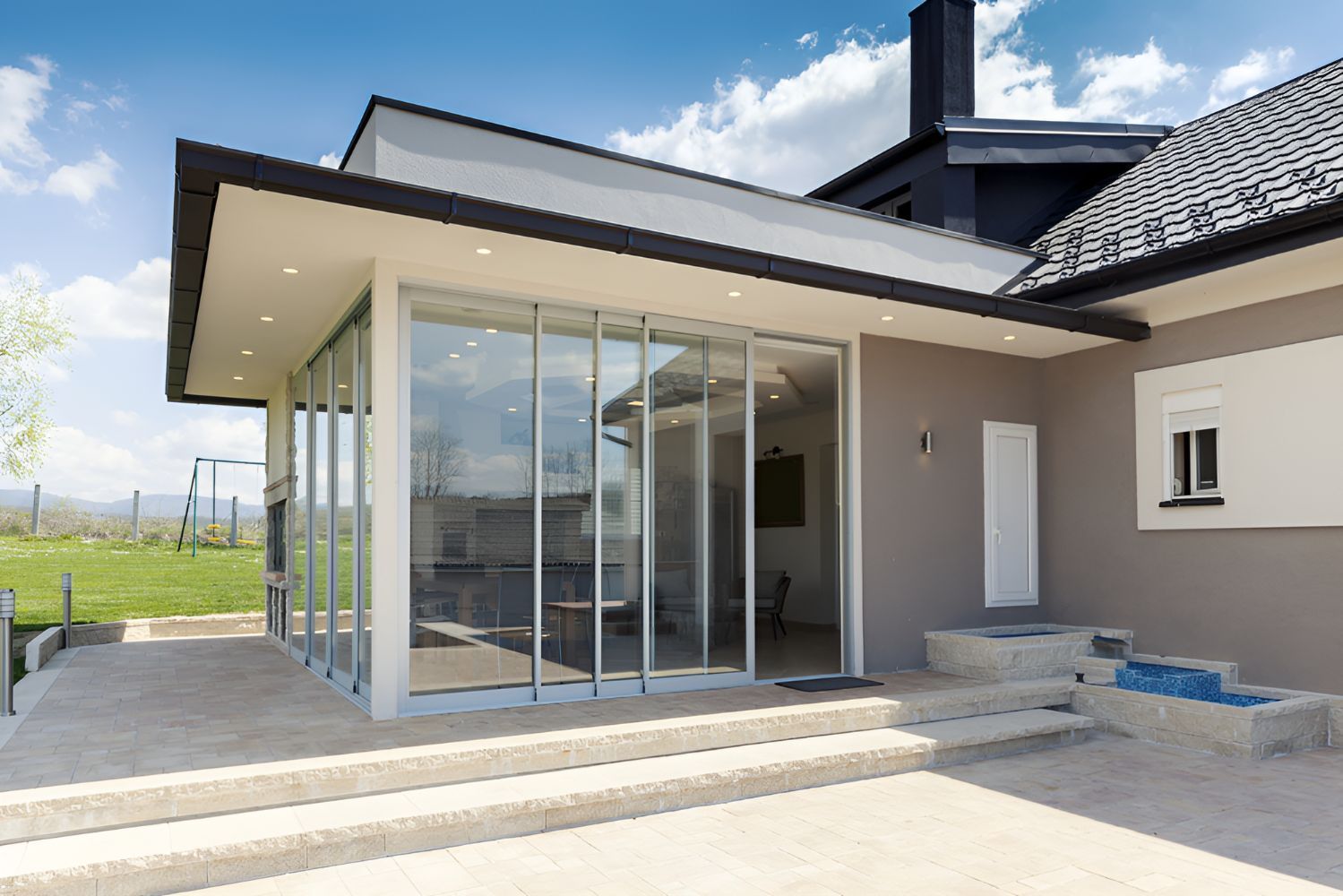 A Large House With a Lot of Windows and Stairs Leading Up to It — Twin Cities Glass In Albury, NSW