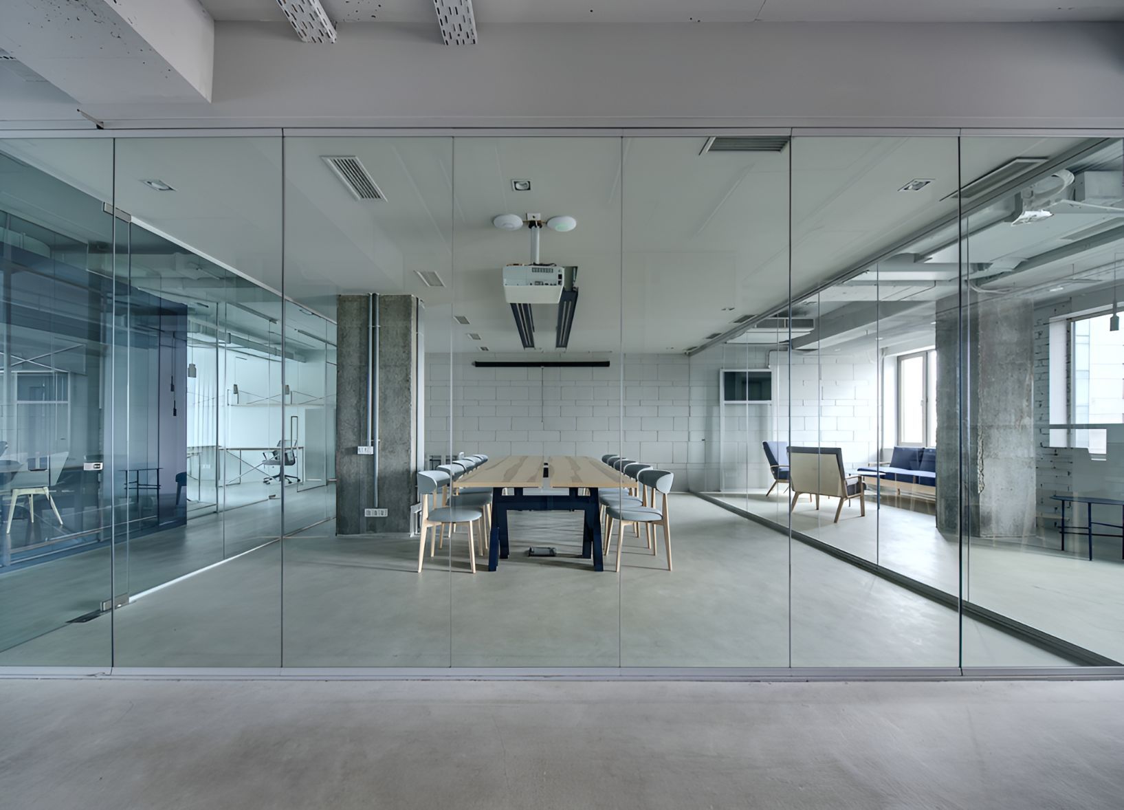 A Conference Room With a Long Table and Chairs Behind Glass Walls — Twin Cities Glass In Albury, NSW