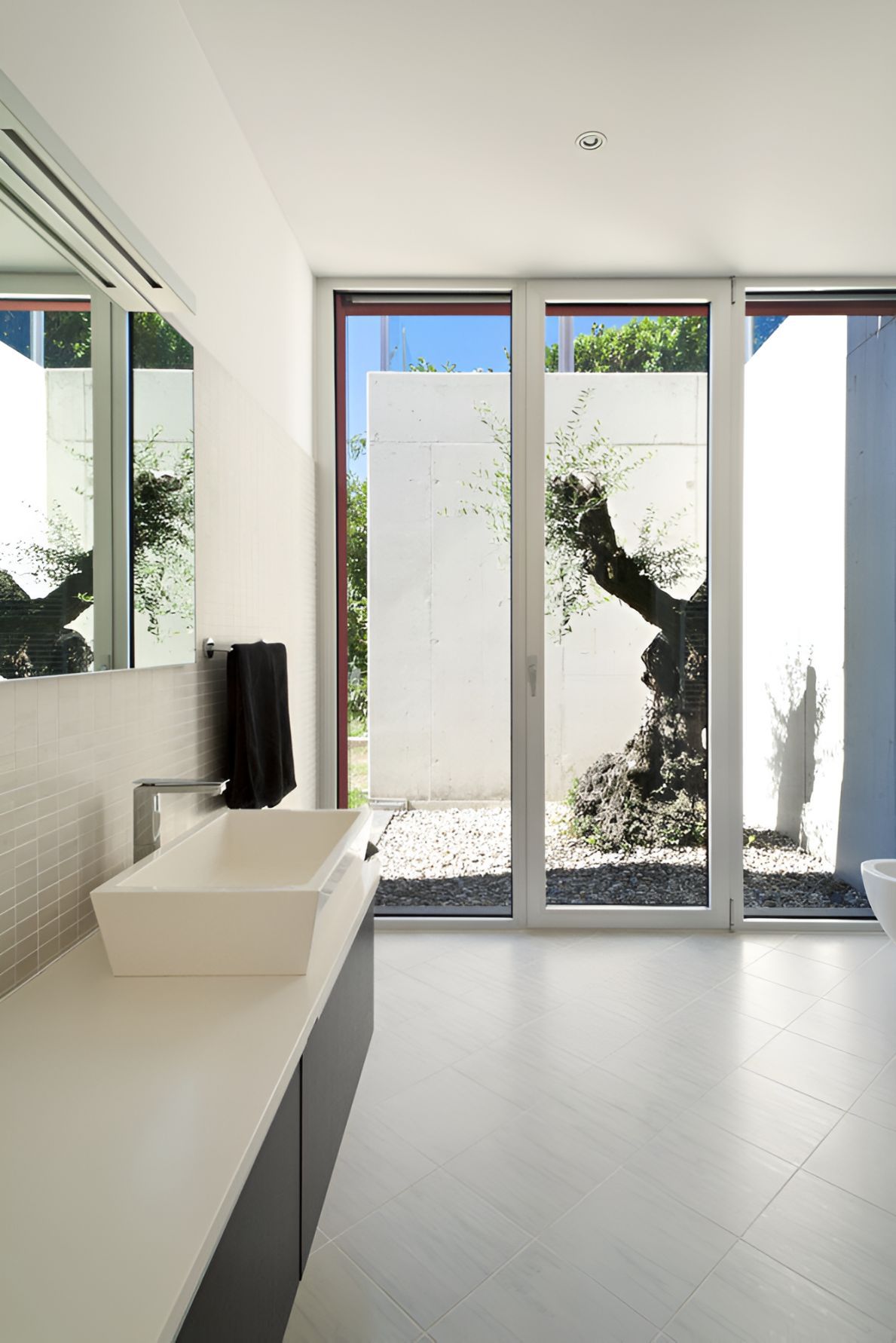 A Large glass Folding door in a bathroom  — Twin Cities Glass In Albury, NSW