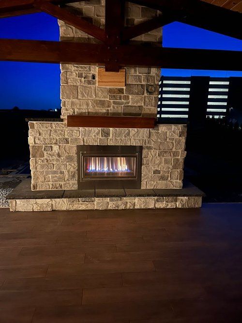 There is a fireplace in the middle of the room.