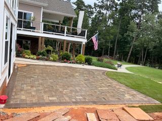 A large house with a large patio in front of it.