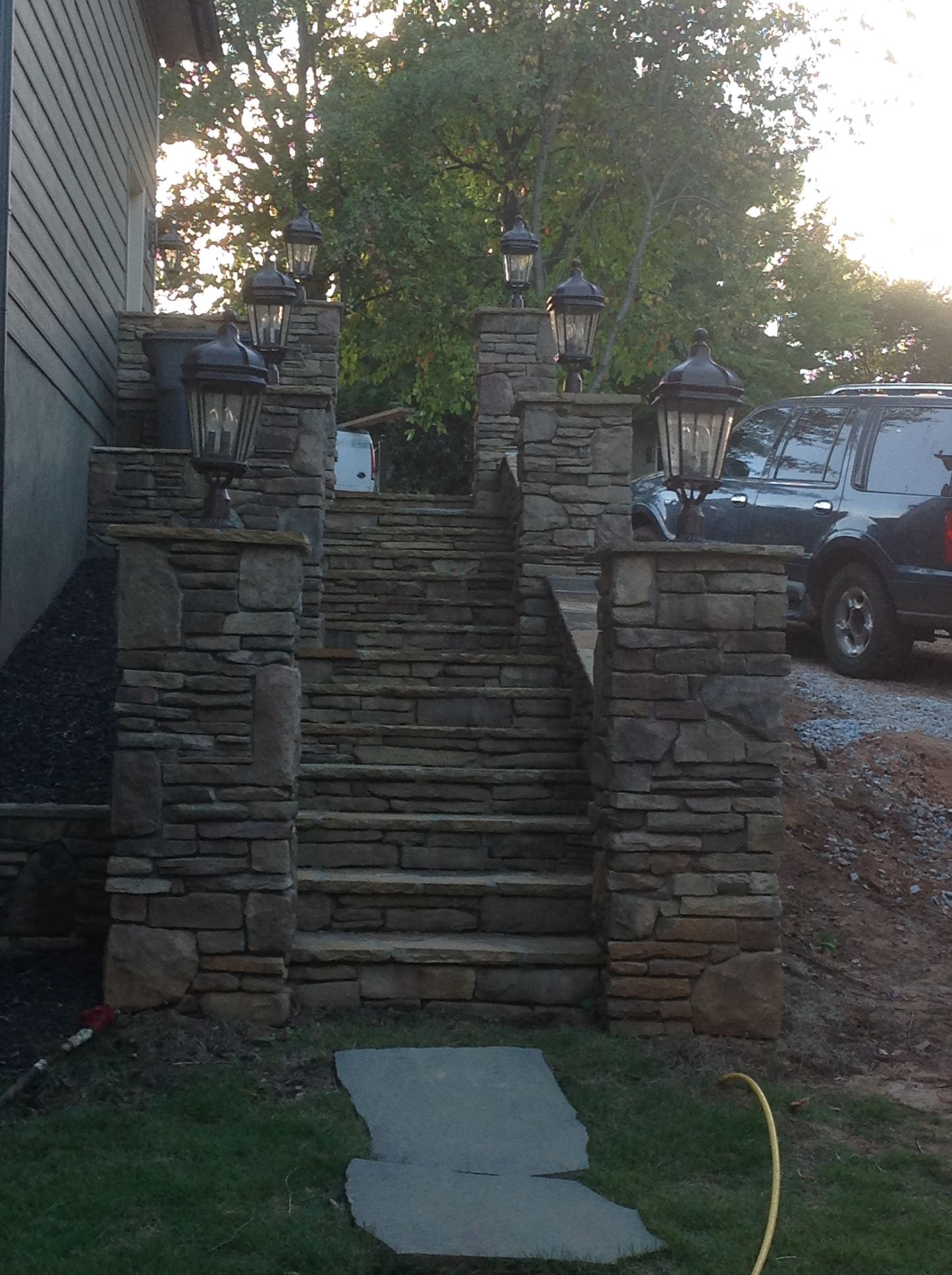 A set of stone stairs leading up to a house