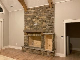 There is a fireplace in the middle of the room.