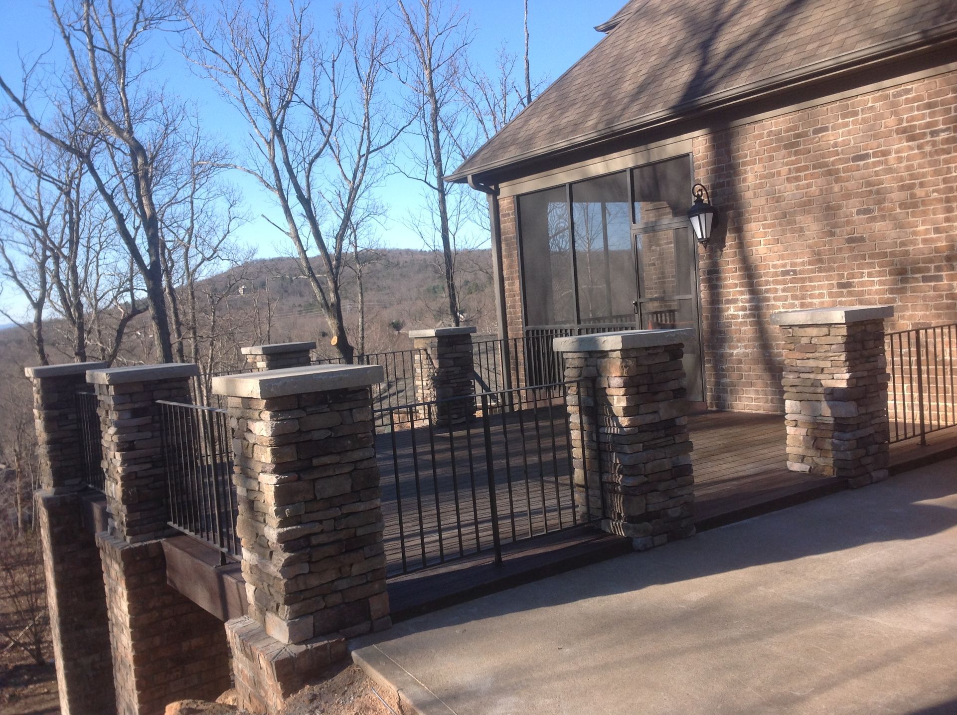 A large brick house with a fence around it